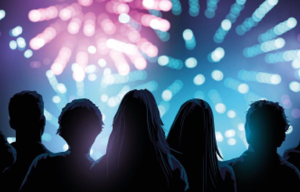 A crowd watching fireworks Illustration: Shutterstock