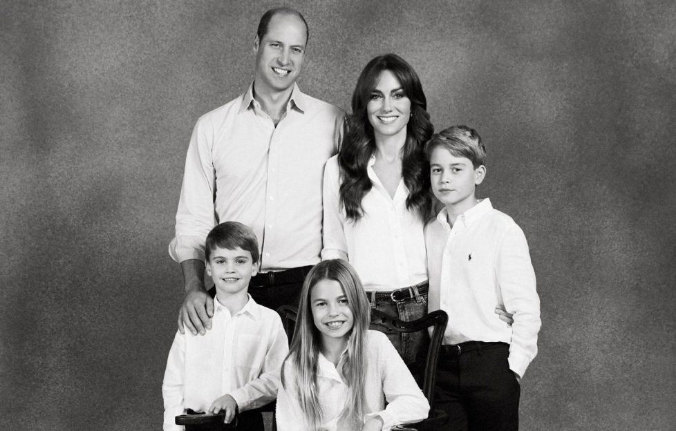 Black and white Royal Christmas card from the Cambridges. Seen posing together in a pared back look consisting of simple backdrop while they are all coordinated in white shirts and denim jeans.