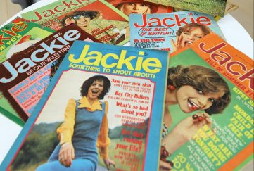A pile of archived Jackie magazine issues featuring an array of popular cover stars of the time.