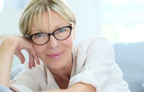 Beautiful lady in her fifties wearing glasses