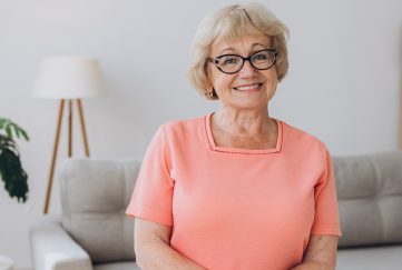 Happy, elderly lady at home