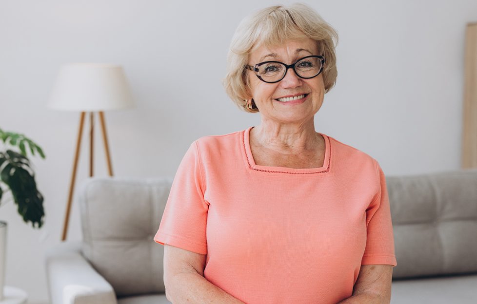 Happy, elderly lady at home