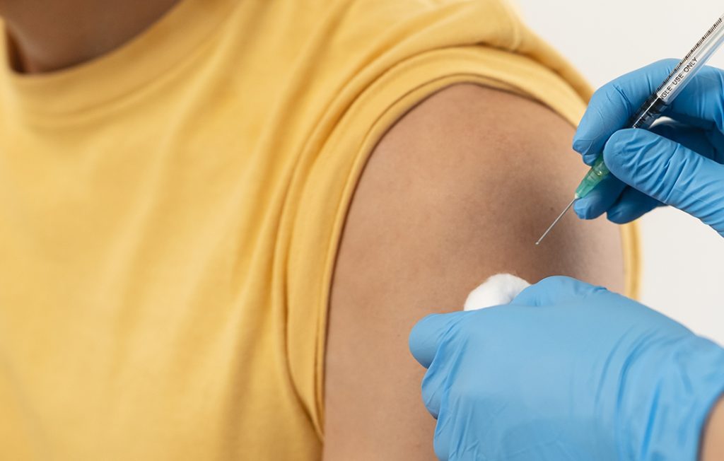 Lady getting a flu vaccine