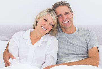 Happy older couple in bed