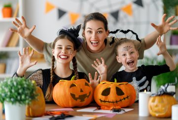 Family with their carved Halloween pumpkins