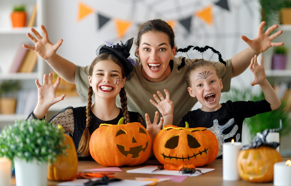 Family with their carved Halloween pumpkins