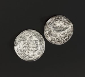 A hoard of silver was buried with Anglo-Saxon and Arabic coins at Storr Rock on Skye around 935 to 940. The nature of the hoard and mixture of coins and bullion from far-flung areas indicate that it belonged to a Viking trader or settler. In the Viking world, silver and, to a lesser extent, gold were used as a medium of exchange, weighed on balances. Any type of silver, complete objects, coins or hacksilver, was valid tender. Much of the silver was nicked and bent to test its purity.