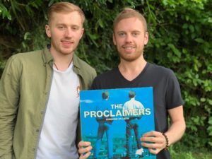 Louise Bell and his brother, Oscar, with their late dad Ian's own original vinyl copy of the Proclaimers' album, 'Sunshine on Leith'. NO F34 Louie and Oscar Bell proclaimers