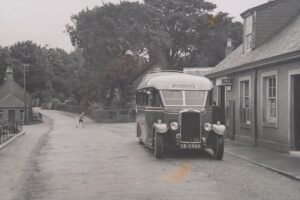 What a difference 10 years make! This 1937 Leyland Cub is depicted at the old Post Office at Clachan. It had a fully enclosed heated saloon and comfortable seats even though local roads would still offer a bumpy ride at times.