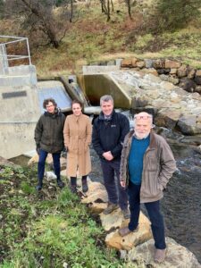 Local MSP Kate Forbes with Jane Stuart-Smith, of MCDC; Ian Philp of HIE and Angus Robertson, also of MCDC. NO F49 Jane Stuart-Smith, KF, Ian Philp and Angus Robertson Barr Hydro scheme GB