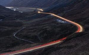Glencoe Flow by Graham Cameron. I had been meaning to take this picture for a considerable time as I like the shape of the road and the juxtaposition of the lights and the landscape. The exposure here is four minutes,' said Graham. Copyright Graham Cameron.  