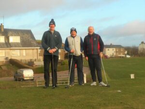 Colin Hanbidge, John Marrison and David MacBrayne preparing to tee off in the January 2 competition.